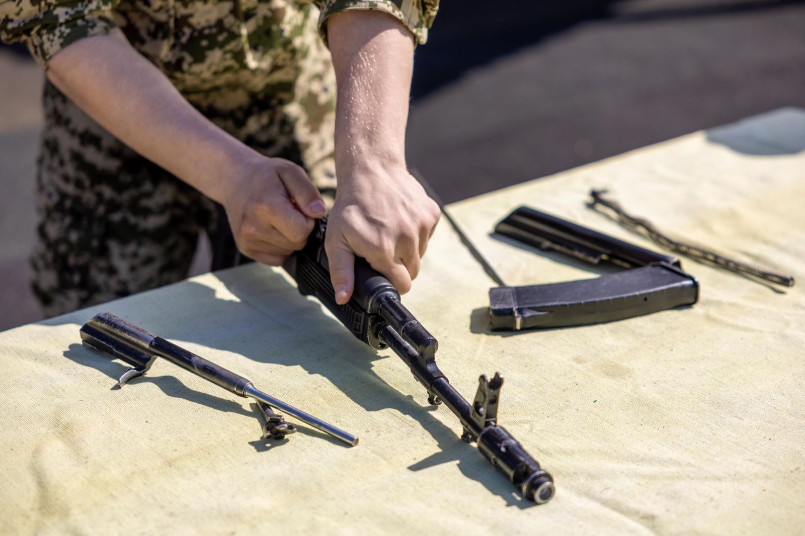 Rack of machined firearm receivers and components